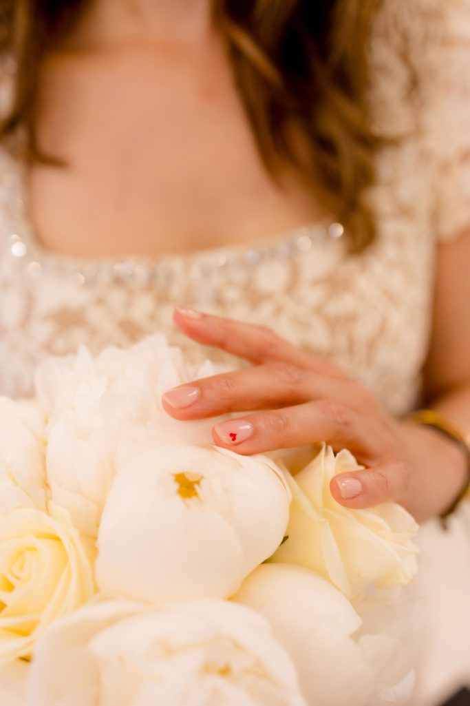 Wedding bouquet and bridal manicure