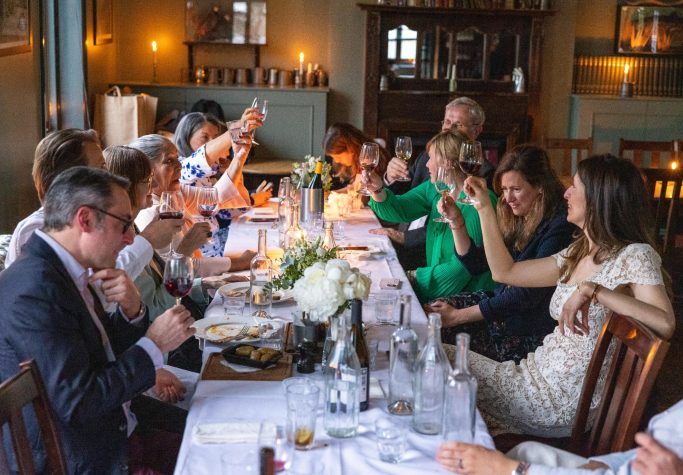 Family celebration of a wedding behind a long table